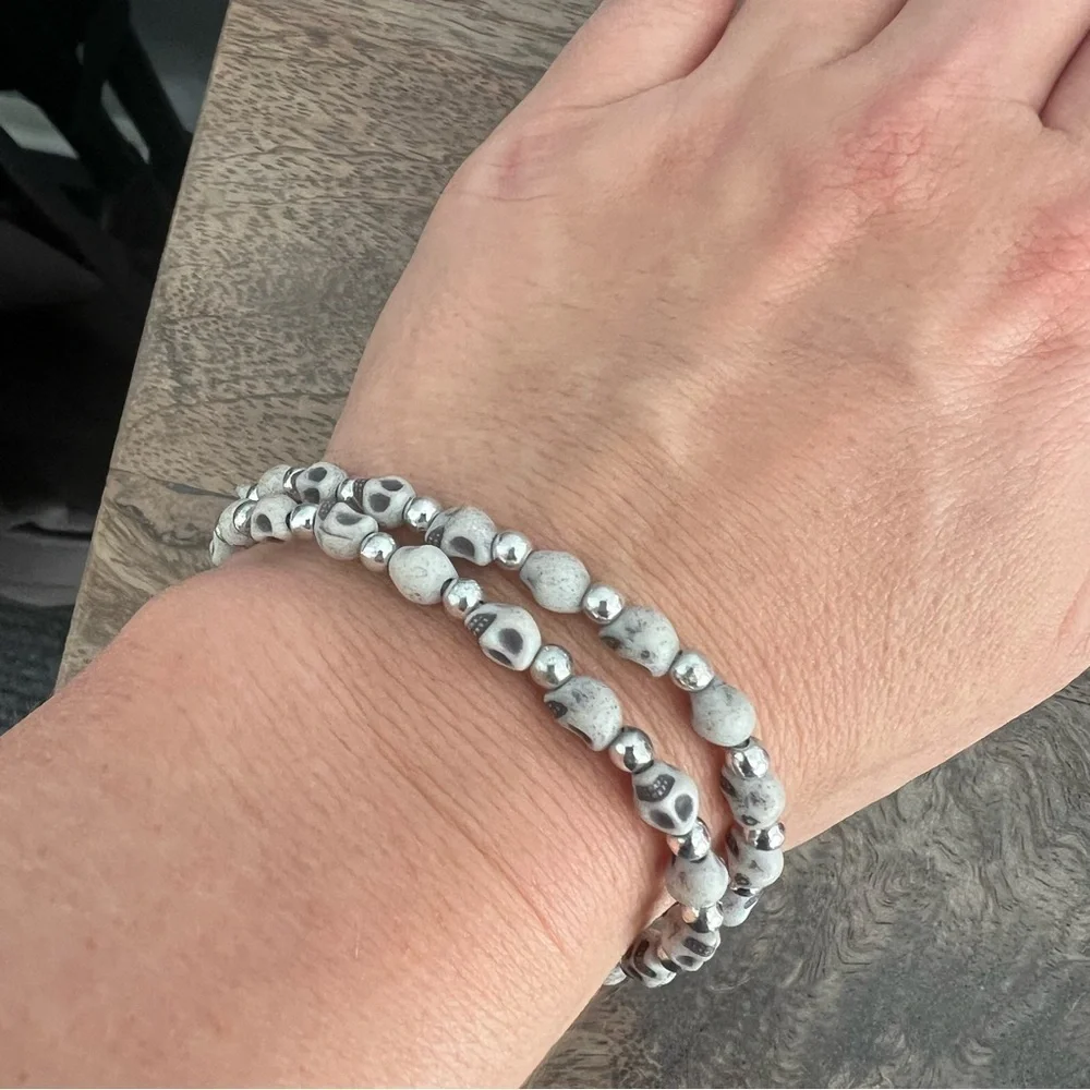 Skull face and silver tone bead stretch bracelet set